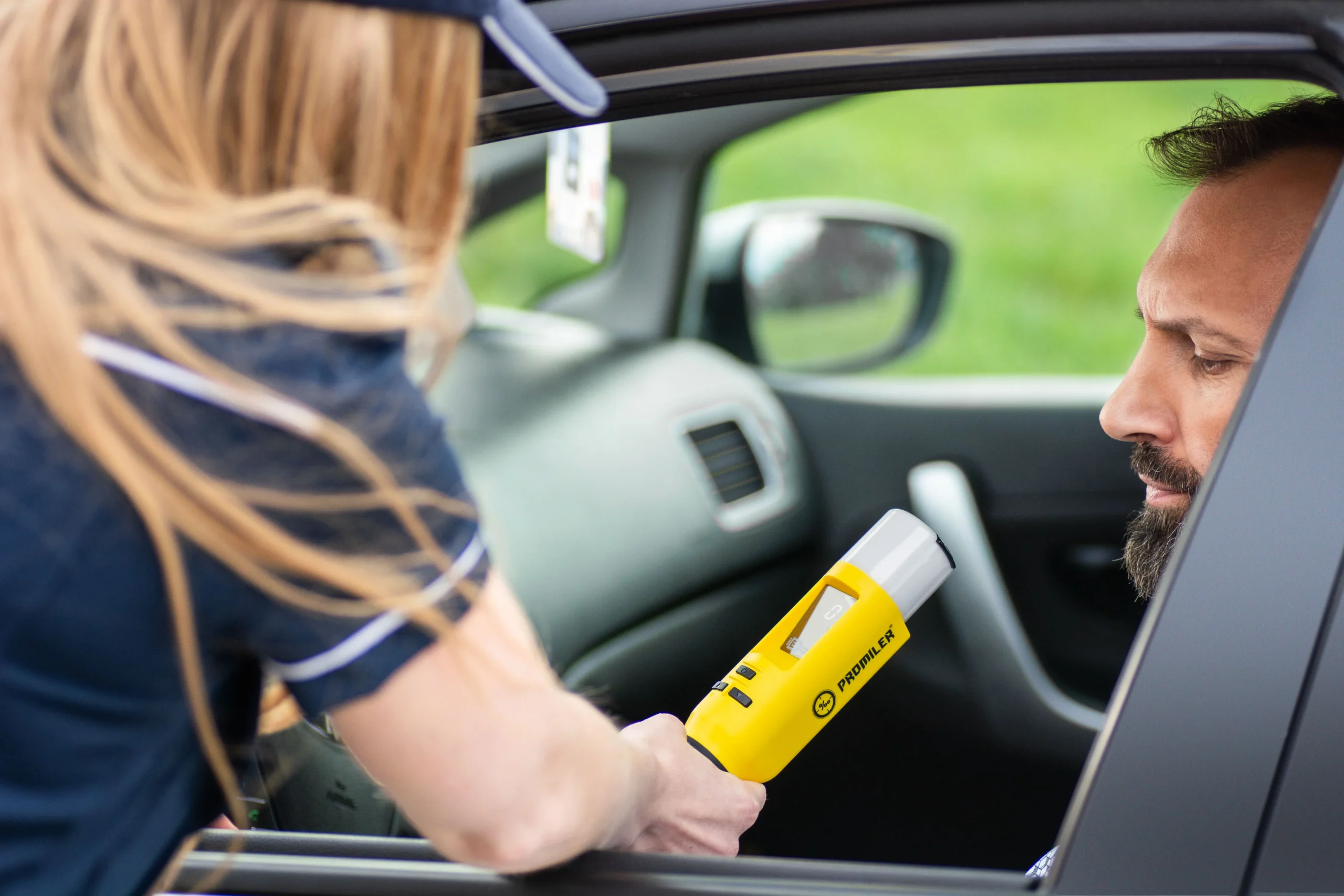 Arizona ignition interlock device being used during a vehicle breath test.